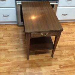 Mid-century end table USA brass wheel