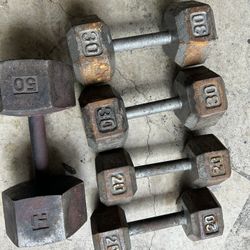Rusty dumbbells 2-20lbs, 2-30lbs, and 1 single 50lbs