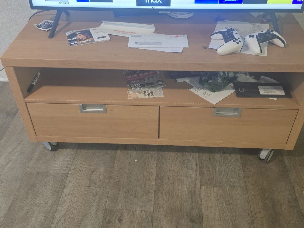Television stand featuring two storage racks