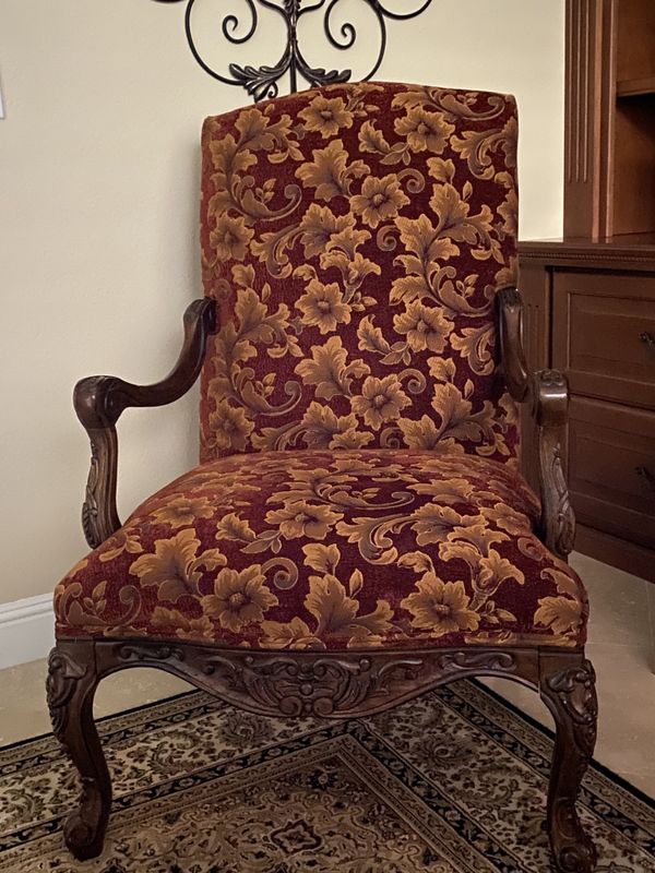 High back upholstered chair carved wood arms and legs for Sale in Las
