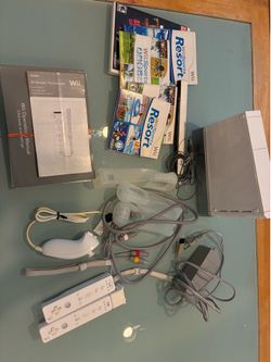 Original Wii console comes with cables and games