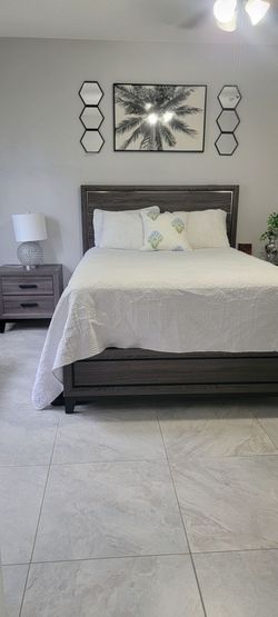 Queen bed with two tables