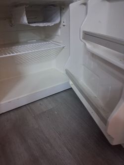 White small refrigerator with small freezer inside very spacious
