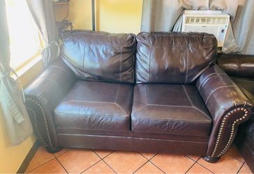 Brown leather loveseat sofa