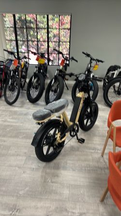 Full suspension moped style stepthru Ebike