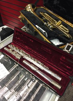 Eastman Flute, case and music stand.