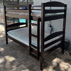 Solid wood bunk bed, double on double, 2 mattresses included. I can deliver for an additional cost. Convertible into 2 twin beds if you don’t want it