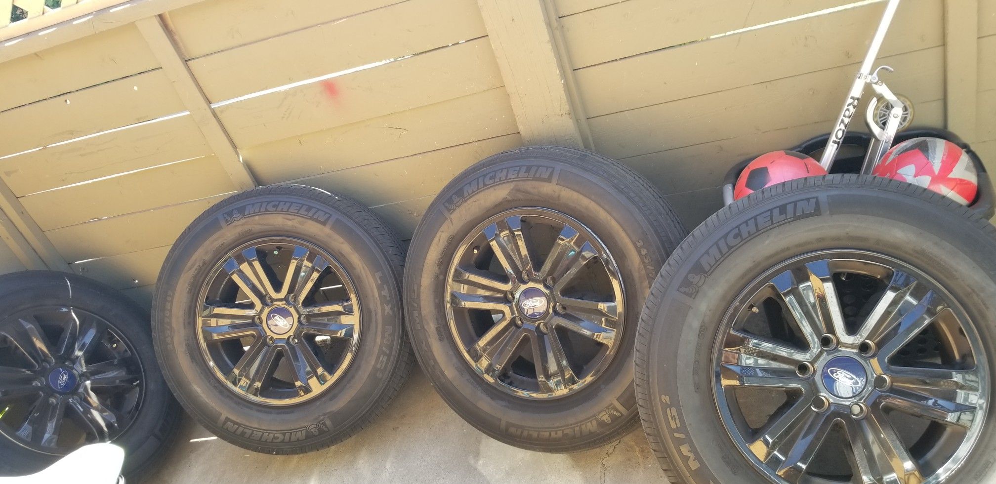 F150 17" rims with black hubcaps.