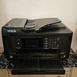 Hey, check out the WF-7710 printer – it's wireless, wide-format, and does everything!