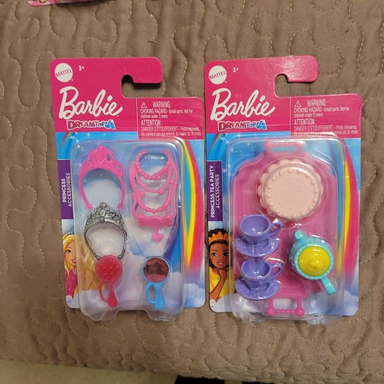 2 packs of Barbie accessories.