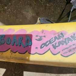 Ocean Kayak  Pink and yellow with Oars. 