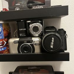 Send Offers. 3 Film and Digital Cameras - Nikon, Konica, Fujifilm