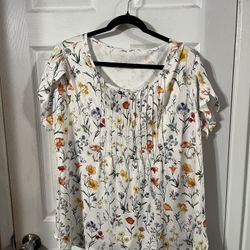 Women’s Size 3X Tunic Length Top.  With a floral print.  Made of 95% Polyester and 5% Spandex.  Brand new never worn . 