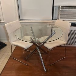 Round Dining Table Set With Glass Top And Two White Chairs