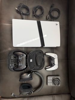 PS5 pro with headset and controllers