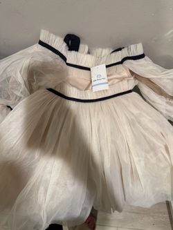 Two designer dresses