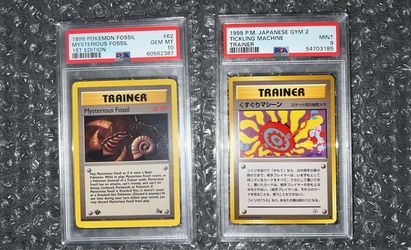 1999 1st Edition Mysterious Fossil PSA 10 and 1999 Tickling Machine Trainer PSA 9