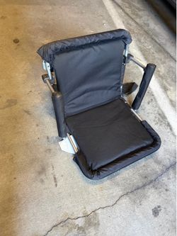 Folding stadium seat