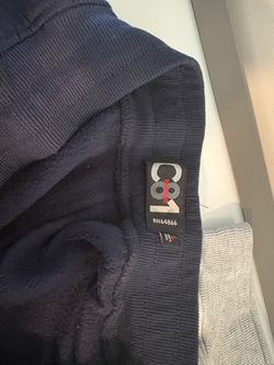 Large blue and grey sweat shorts.