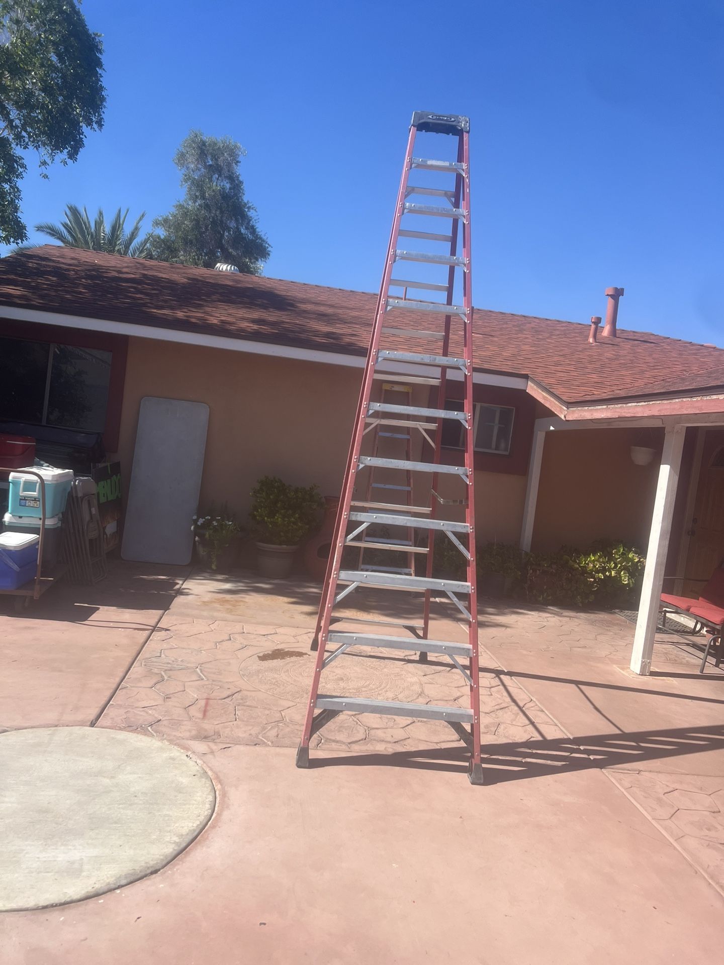 12 feet Werner Frame Ladder in good condition, 300 lbs. $175