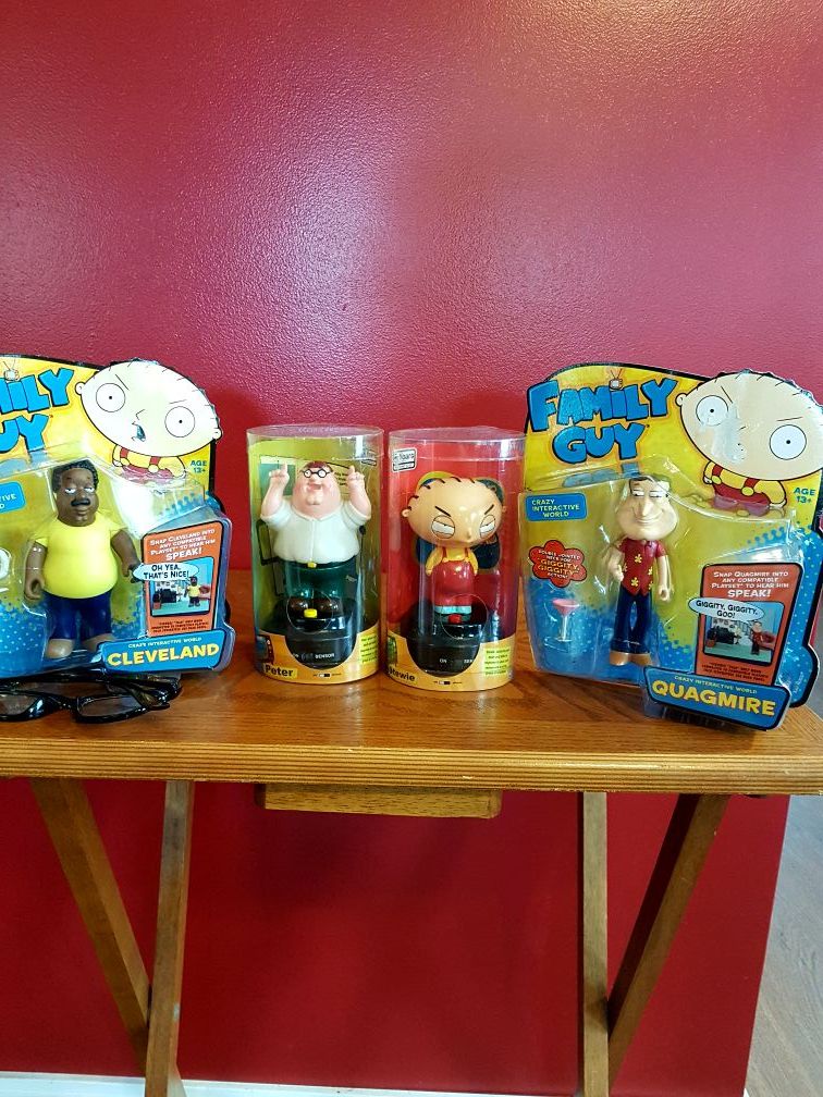 Family Guy characters two talking dashboard figurines Peter and Stewie and two crazy interactive World figures Quagmire and Cleveland