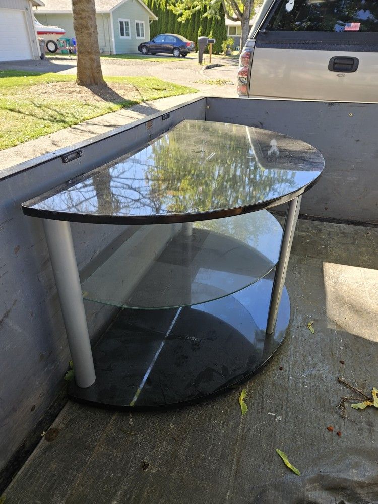 Very nice t v stand.... Moving, and don't have room to take it.