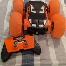 New Bright Super Rebound Battery Remote Control Orange Stunt Vehicle $15 firm