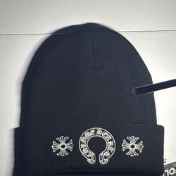 Black beanie with cross-style embroidery. One size fits most. Good condition.  This item is a designer-inspired piece. No brand affiliation. Please re