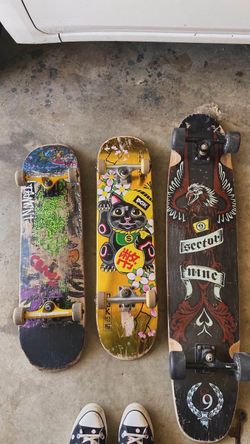 Two skateboards and one long board