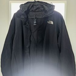 Black HyVent jacket with hood by The North Face. 