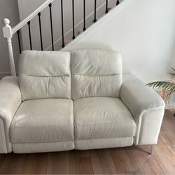 Modern Beige Leather Reclining Sofa Set ( 2 pieces ). Both pieces feature reclining functionality.