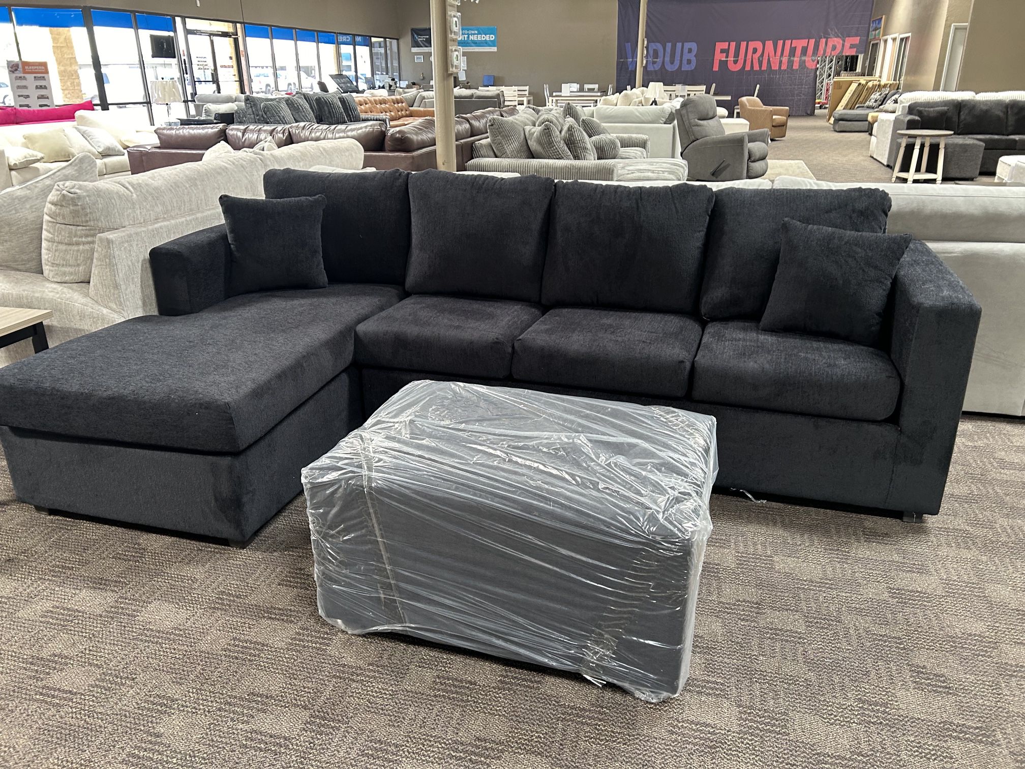 New Black Sectional And Ottoman
