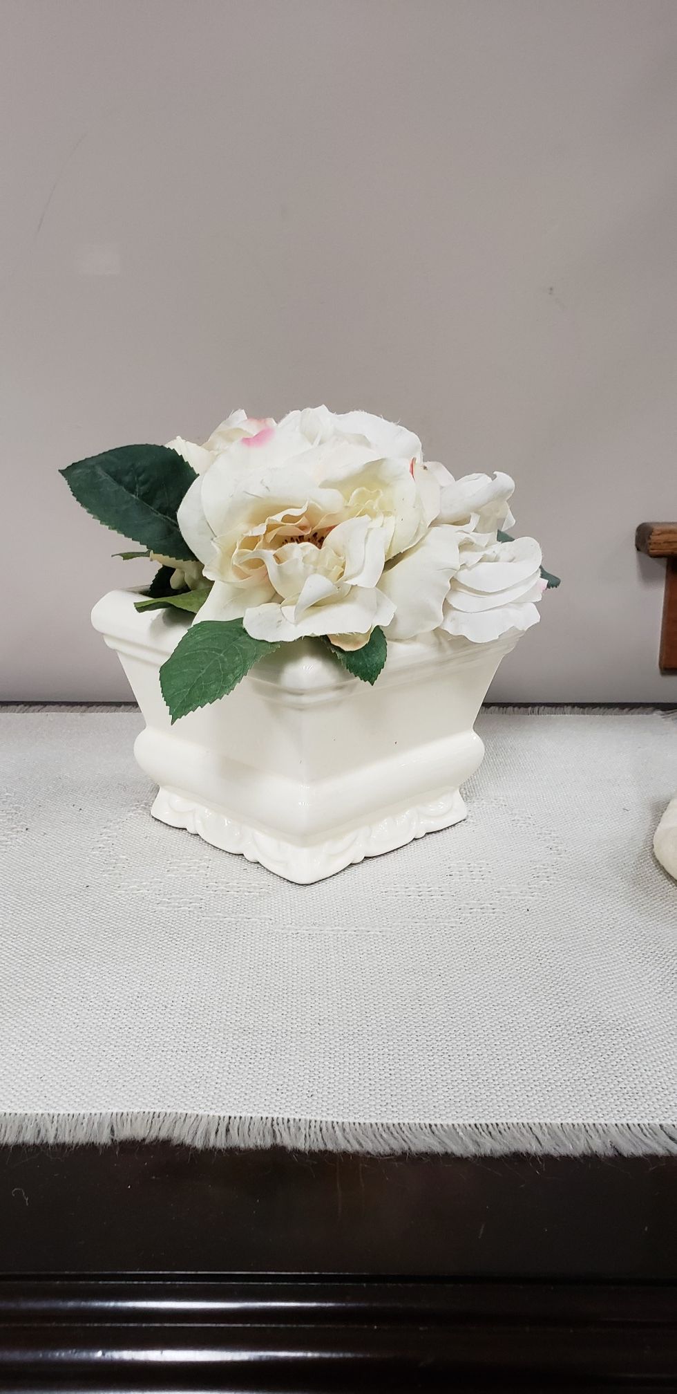 Beautiful faux flower arrangement in ceramic pot