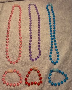 Three Necklaces And Four Bracelets