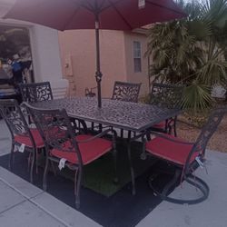 Patio Set Table And 6 Chairs With New Cushions And New Umbrela 