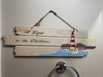 Wooden lighthouse sign