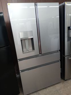 GE Cafe stainless steel four-door french door refrigerator with glass front - Free delivery