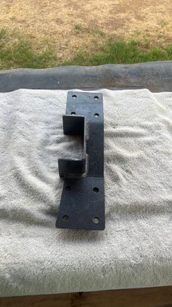 Heavy - duty vehicle mounting bracket/. Textured black coated finish.