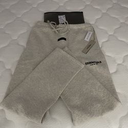 Essentials fear of god light oatmeal uncuffed sweatpants