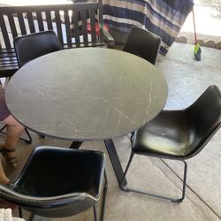 I am selling a round table with 5 semi-new chairs.
