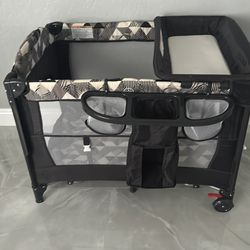 Convertible Crib with Playpen, Rocking Feature, and Snap-On Changing Table