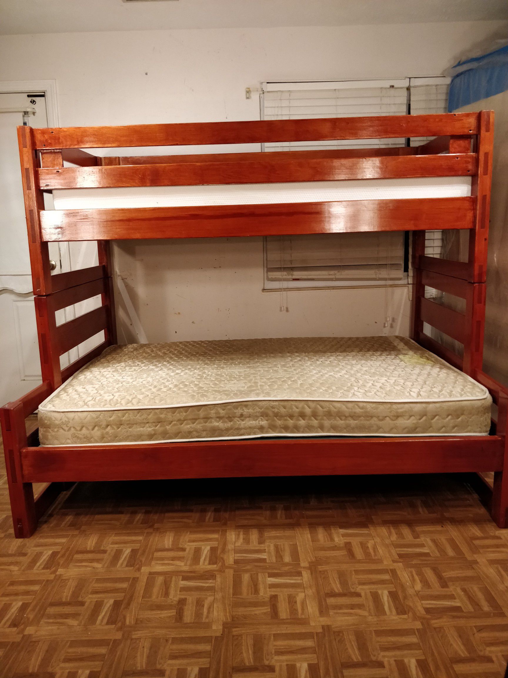 Solid wood Bunk bed with 2 mattresses in good condition, Driveway pickup.
