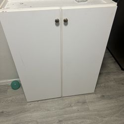 White Storage Cabinets – Solid & Functional ($40 Each)