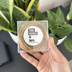 pair of GirlTrek leather golden shoelaces