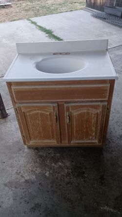 Free  sink cabinet and Two toilets working must take all 3