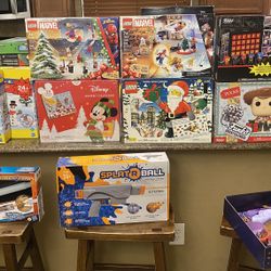 Brand new advent calendars/collectibles. Play doh advent calendars, splat ball, Star Wars lightsaber, Disney wish Barbie dolls and accessories set are