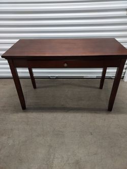 Small dark brown desk.