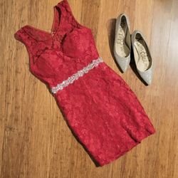 New w/tags Red lace dress with bedazzled front waist open back size 9