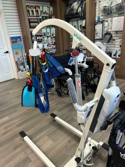 Electric patient lift with sling