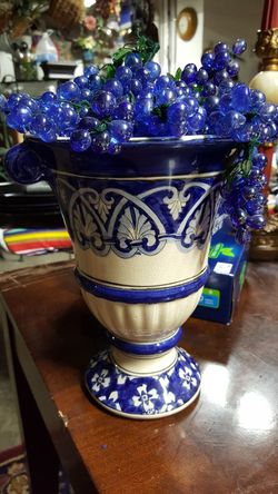 10" High Beautiful blue and cream vase with 15 clusters of blue glass grapes